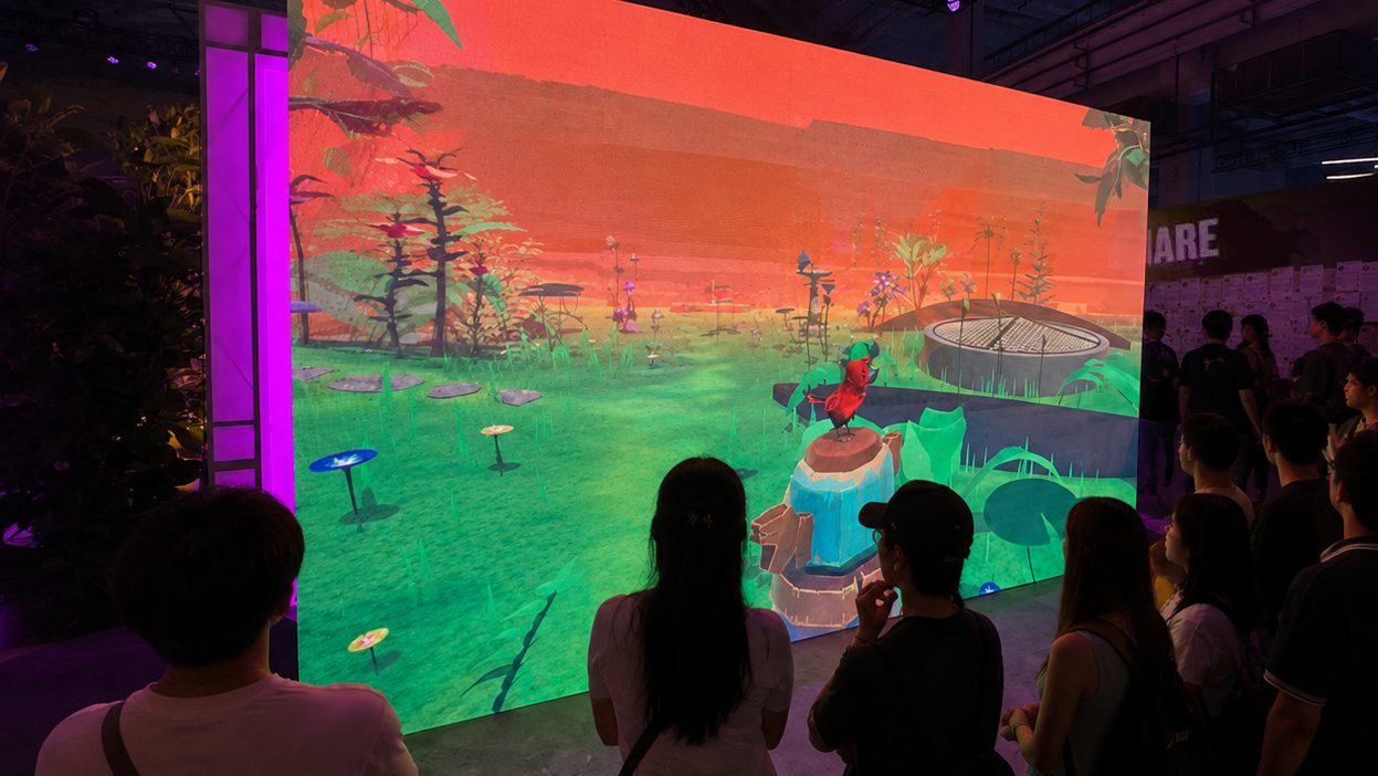 Visitors watching the Empathy Creatures life simulation on a large LED screen at S-Tron Shanghai