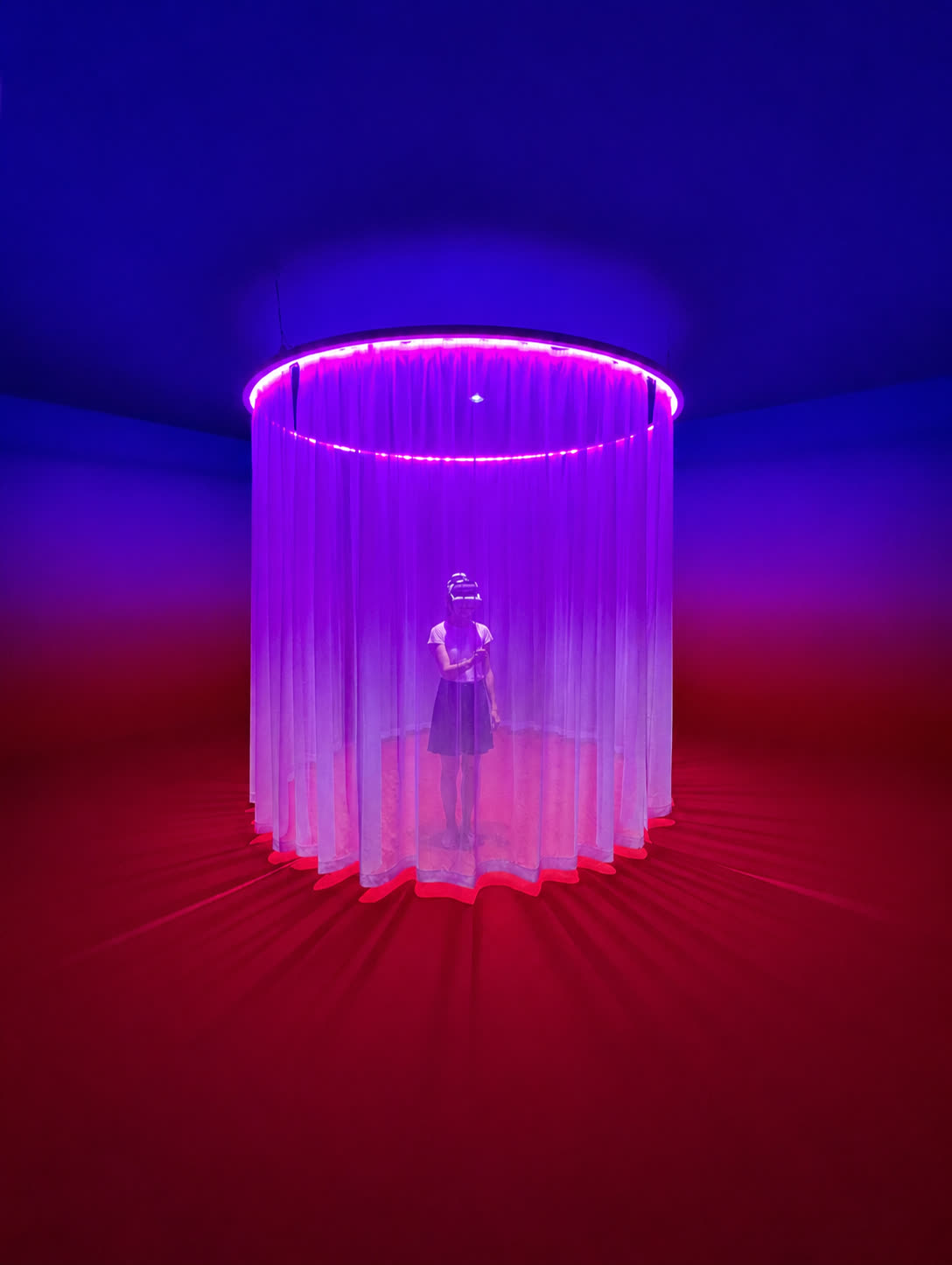 Participant wearing a VR headset inside the circular Empathy Creatures installation at Venice Immersive 2025
