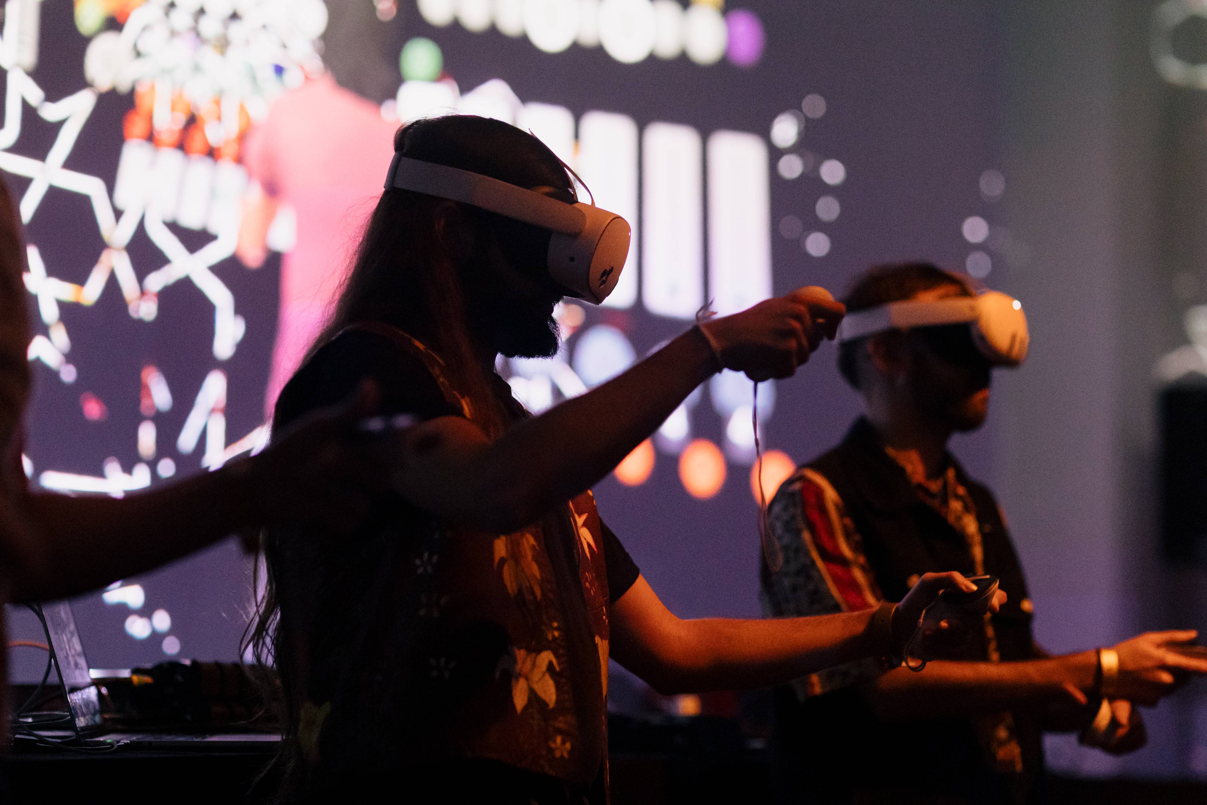 A close-up of ALHAJA performers working inside PatchWorld during the live performance