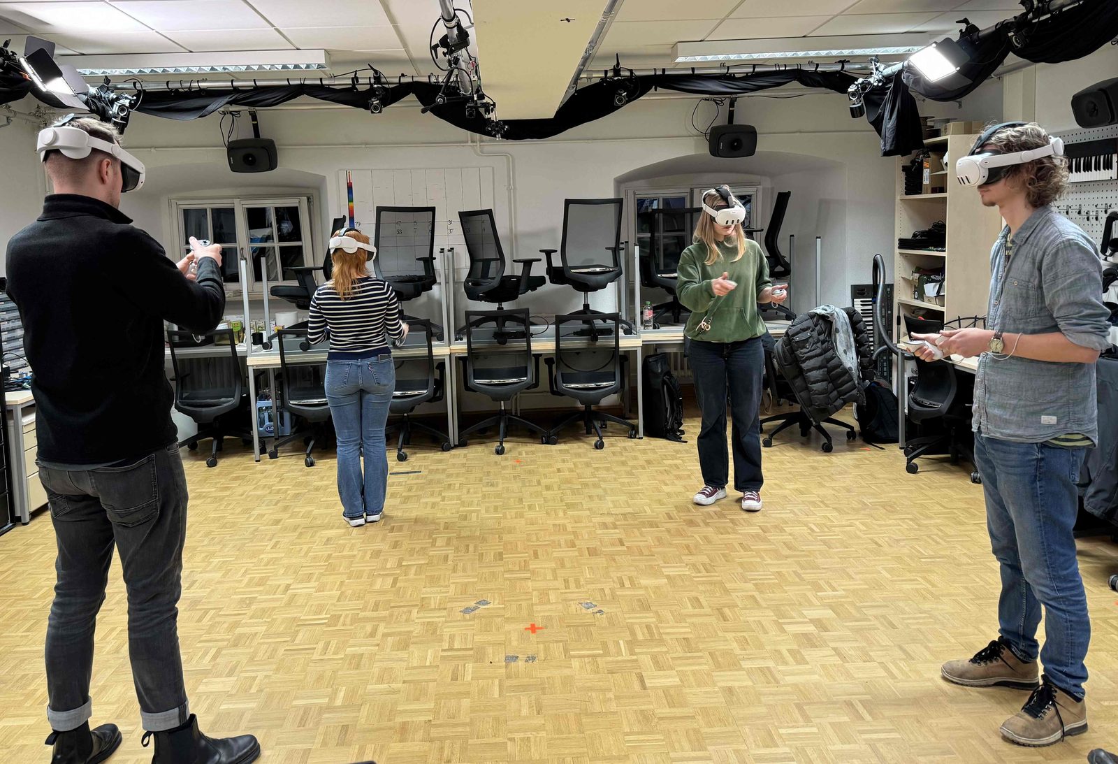 Four participants wearing VR headsets during a music study in the Osnabrück lab